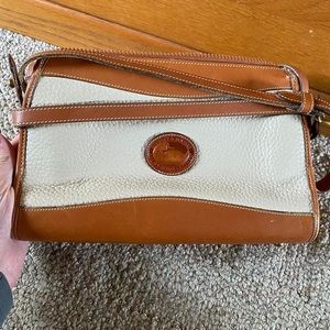 Adorable hand bag, strap is adjustable. No flaws that are noticeable.